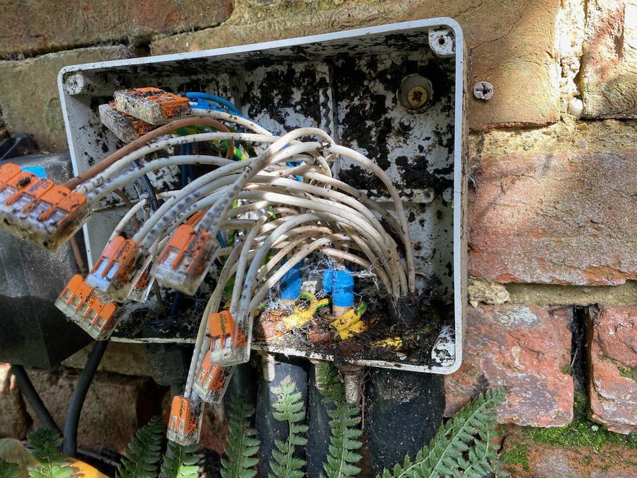 Failed garden lighting fitting before repair