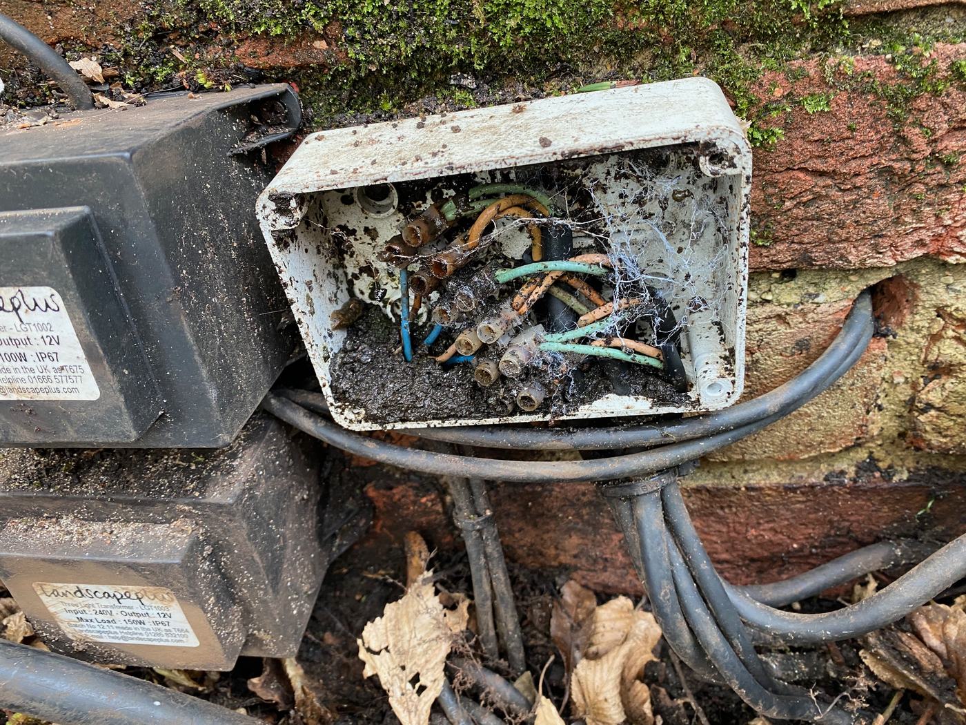 Failed garden lighting fitting before restoration